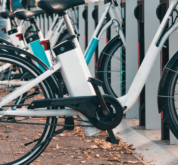 A rack of electric bikes to hire in city area